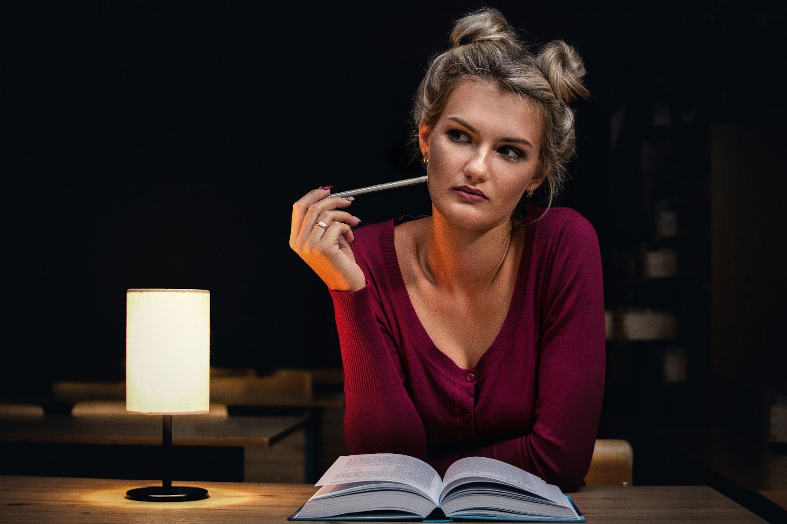 woman sitting in the library thinking